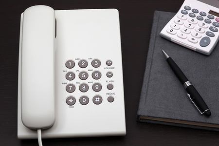 telephone white on a tableの写真素材
