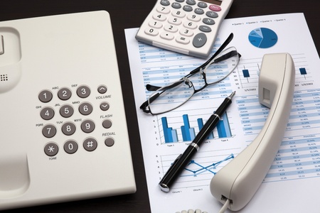 business report with telephone on a tableの写真素材