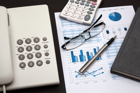 business report with telephone on a tableの写真素材