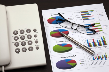 business report with telephone on a tableの写真素材