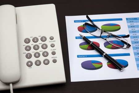 business report with telephone on a tableの写真素材