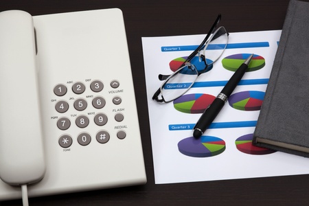 business report with telephone on a tableの写真素材