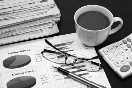 Business report. Cup of coffee on document.の写真素材
