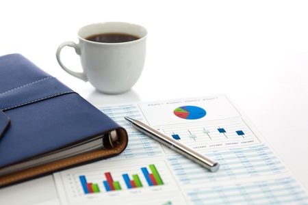 Business report with cup of coffeeの写真素材