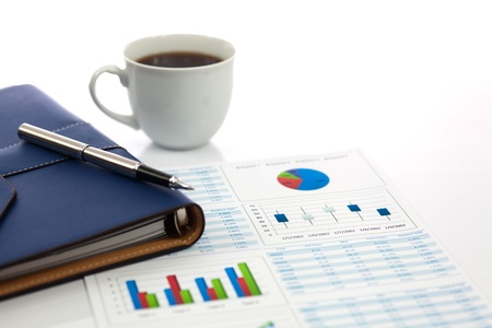 Business report with cup of coffeeの写真素材