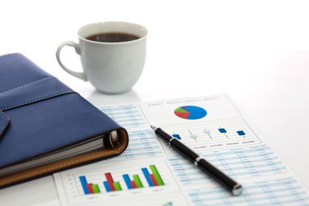 Business report with cup of coffeeの写真素材