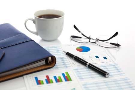 Business report with cup of coffeeの写真素材