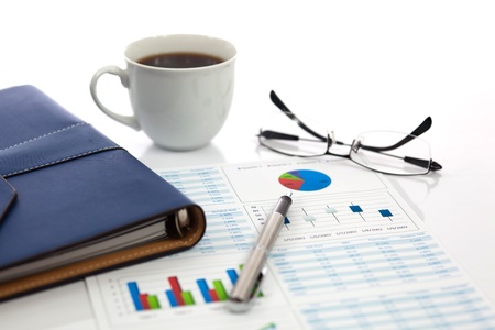 Business report with cup of coffeeの写真素材
