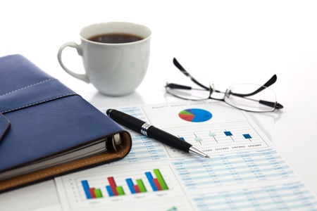 Business report with cup of coffeeの写真素材