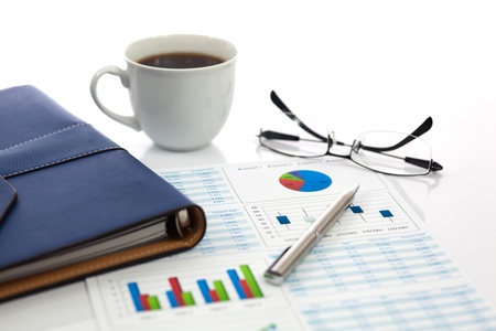 Business report with cup of coffeeの写真素材