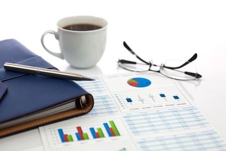 Business report with cup of coffeeの写真素材