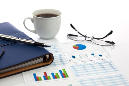 Business report with cup of coffeeの写真素材