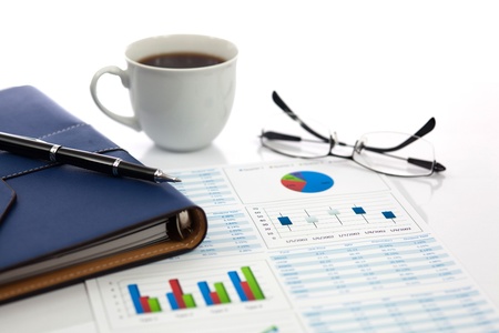 Business report with cup of coffeeの写真素材