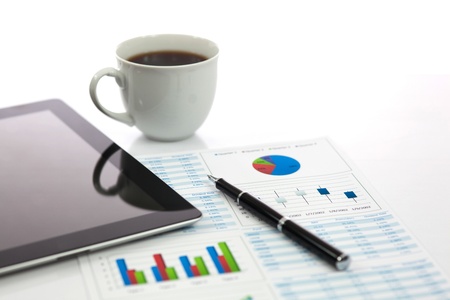 Business report with cup of coffeeの写真素材