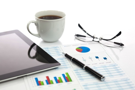 Business report with cup of coffeeの写真素材