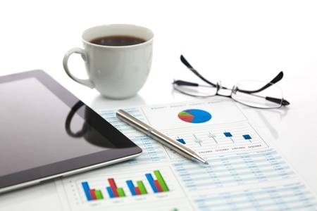 Business report with cup of coffeeの写真素材