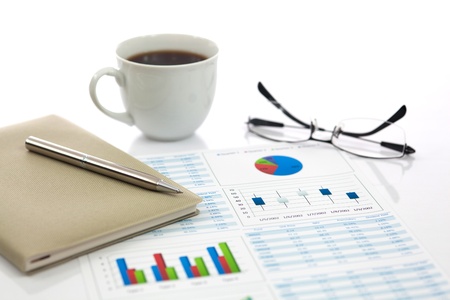 Business report with cup of coffeeの写真素材