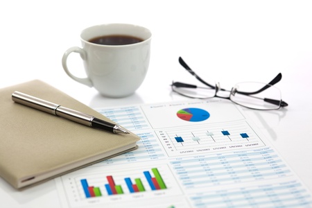 Business report with cup of coffeeの写真素材