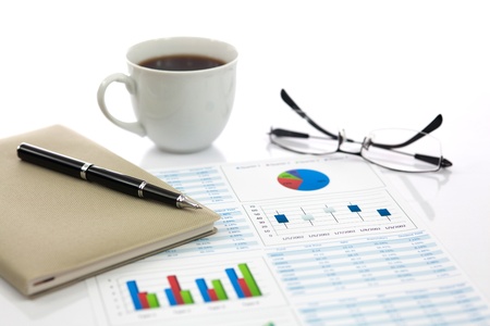 Business report with cup of coffeeの写真素材