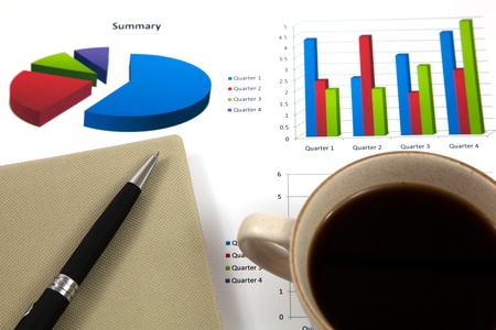 Business report with cup of coffeeの写真素材