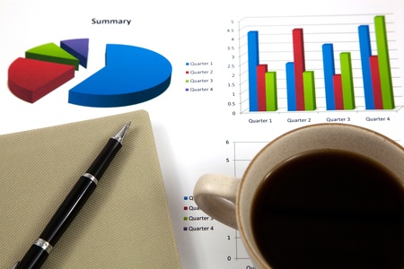 Business report with cup of coffeeの写真素材