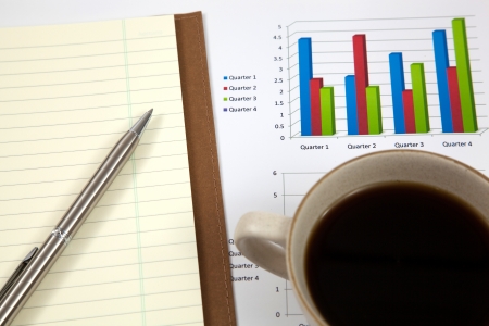 Business report with cup of coffeeの写真素材