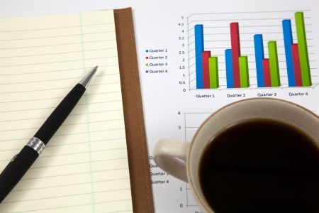 Business report with cup of coffeeの写真素材