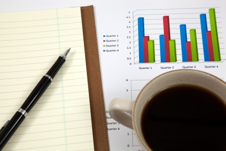 Business report with cup of coffeeの写真素材