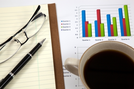 Business report with cup of coffeeの写真素材
