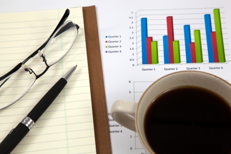 Business report with cup of coffeeの写真素材