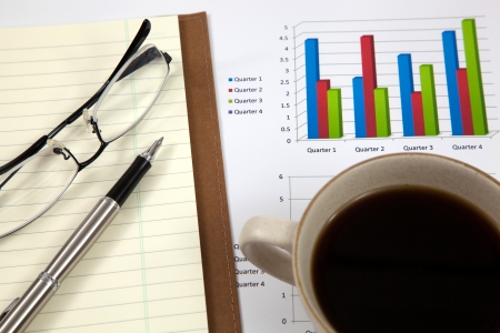 Business report with cup of coffeeの写真素材
