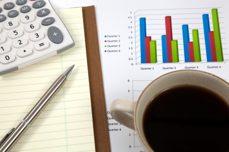 Business report with cup of coffeeの写真素材