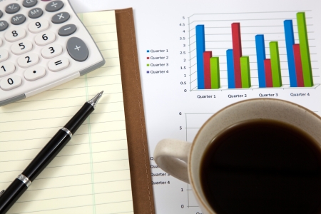 Business report with cup of coffeeの写真素材