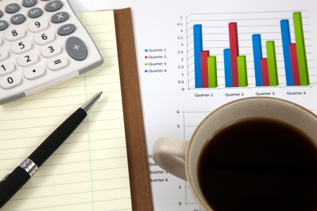 Business report with cup of coffeeの写真素材