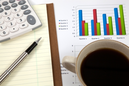 Business report with cup of coffeeの写真素材