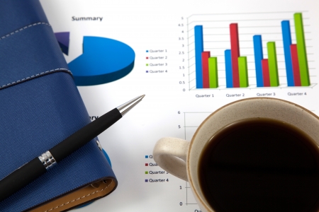 Business report with cup of coffeeの写真素材