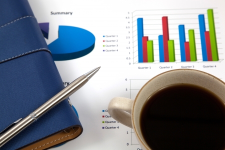 Business report with cup of coffeeの写真素材
