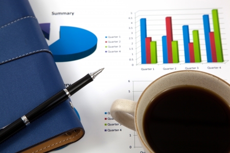 Business report with cup of coffeeの写真素材