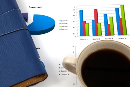 Business report with cup of coffeeの写真素材