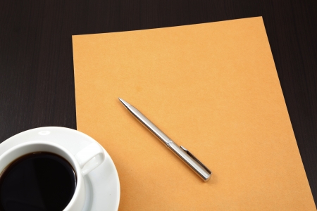 folder with coffee cup on tableの写真素材