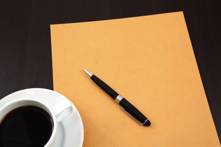 folder with coffee cup on tableの写真素材
