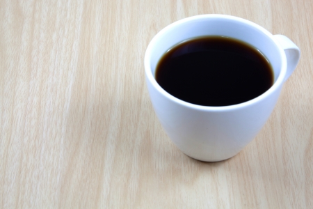 Cup of coffee on a wooden tableの写真素材
