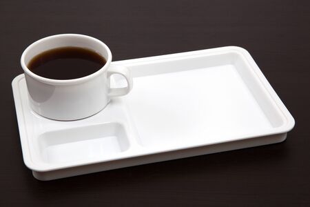 Cup of coffee on a wooden tableの写真素材