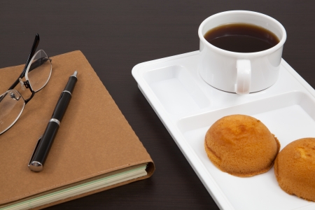 Cup of coffee and bookの写真素材