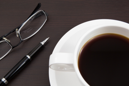 Coffee cup and penの写真素材