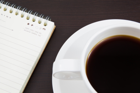 Cup of coffee and bookの写真素材