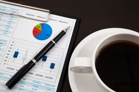 Business report and cup of coffeeの写真素材