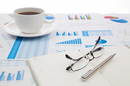 Business report with cup of coffeeの写真素材
