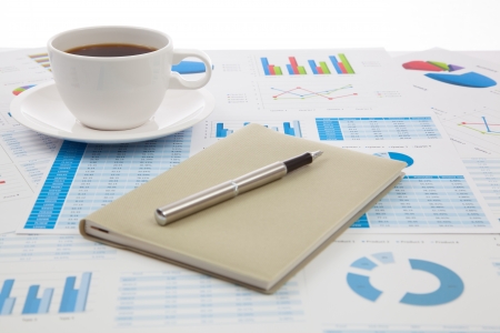 Business report with cup of coffeeの写真素材