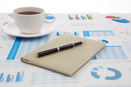 Business report with cup of coffeeの写真素材